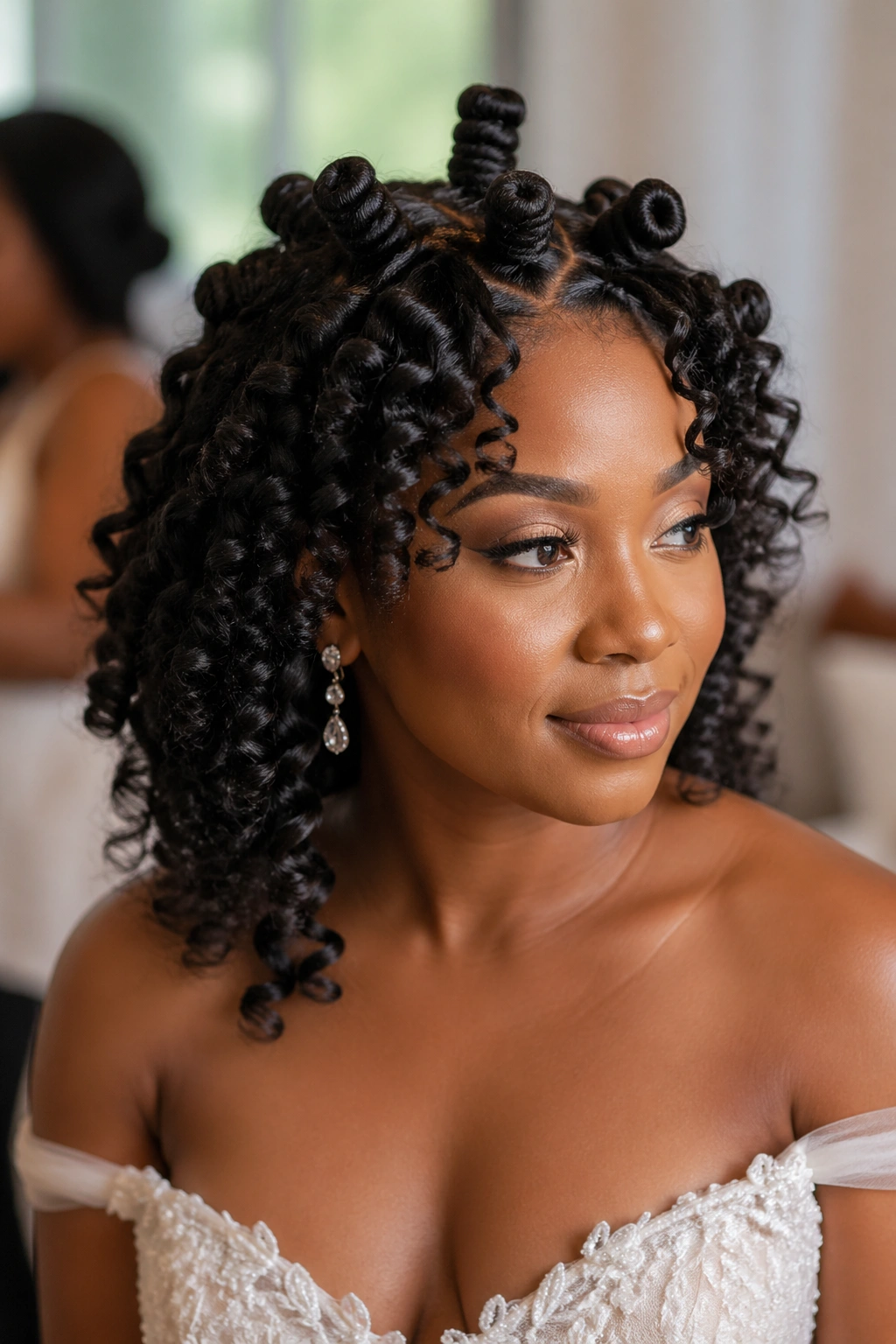 Bride with Bantu knot-out hairstyle featuring defined spirals