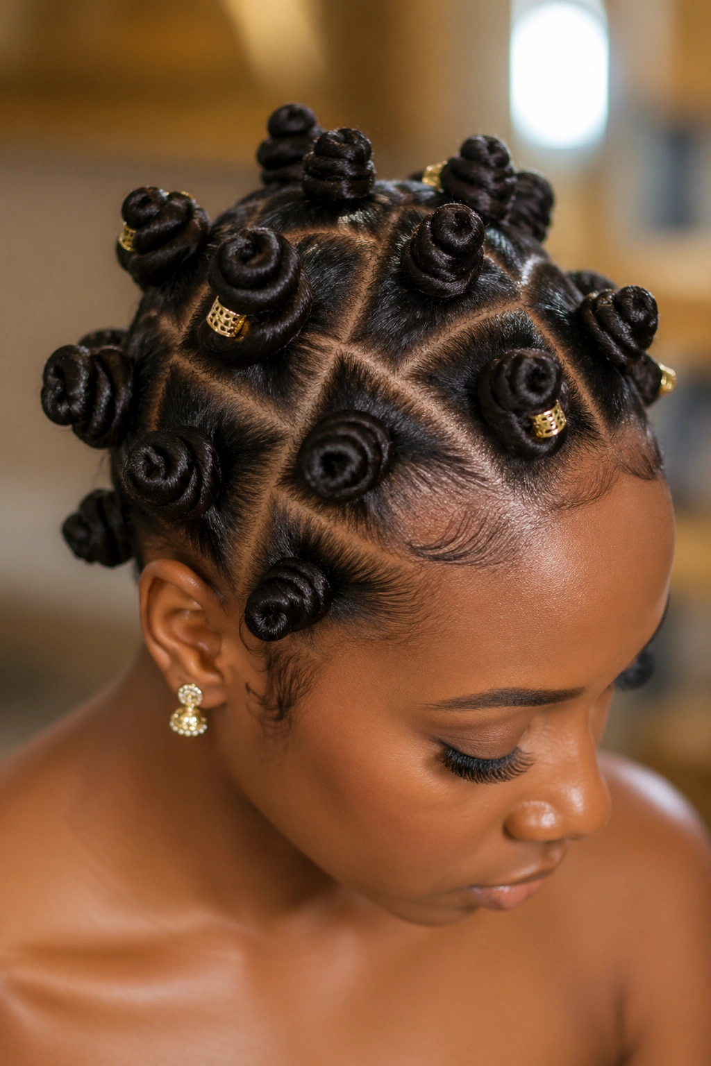 Close-up of a real woman with a full Bantu knot arrangement and gold pins