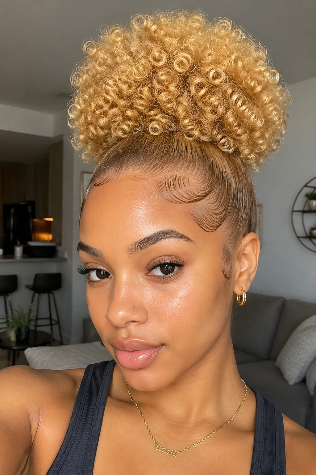 Close-up of a real woman with a blonde high puff and defined edges