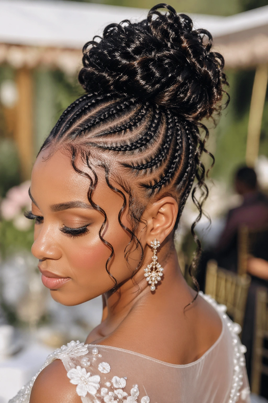 Close-up of a real woman with Bohemian Cornrow Updo featuring flat crown cornrows and a sculpted bun.
