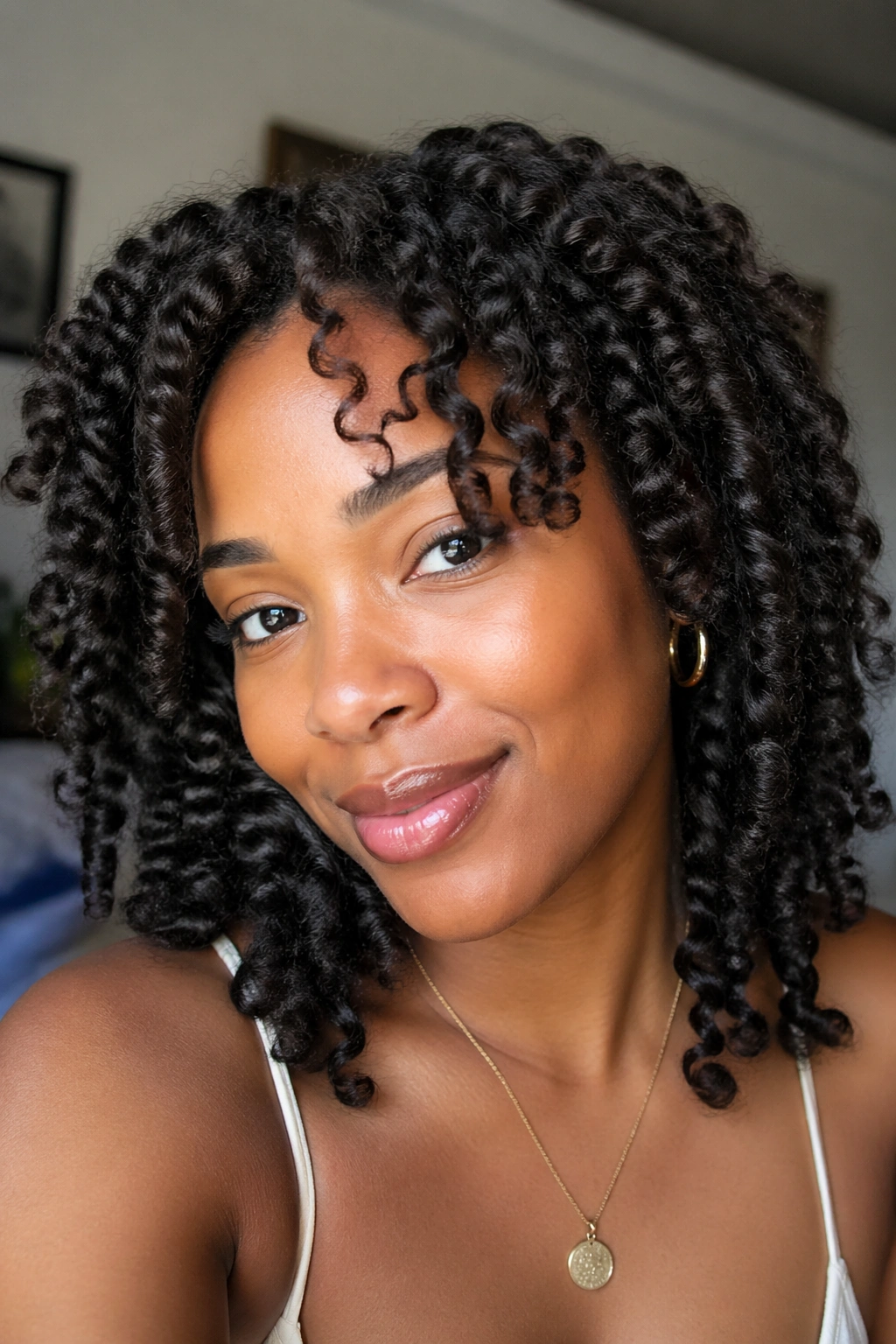 Close-up of a Black woman with braid-out texture
