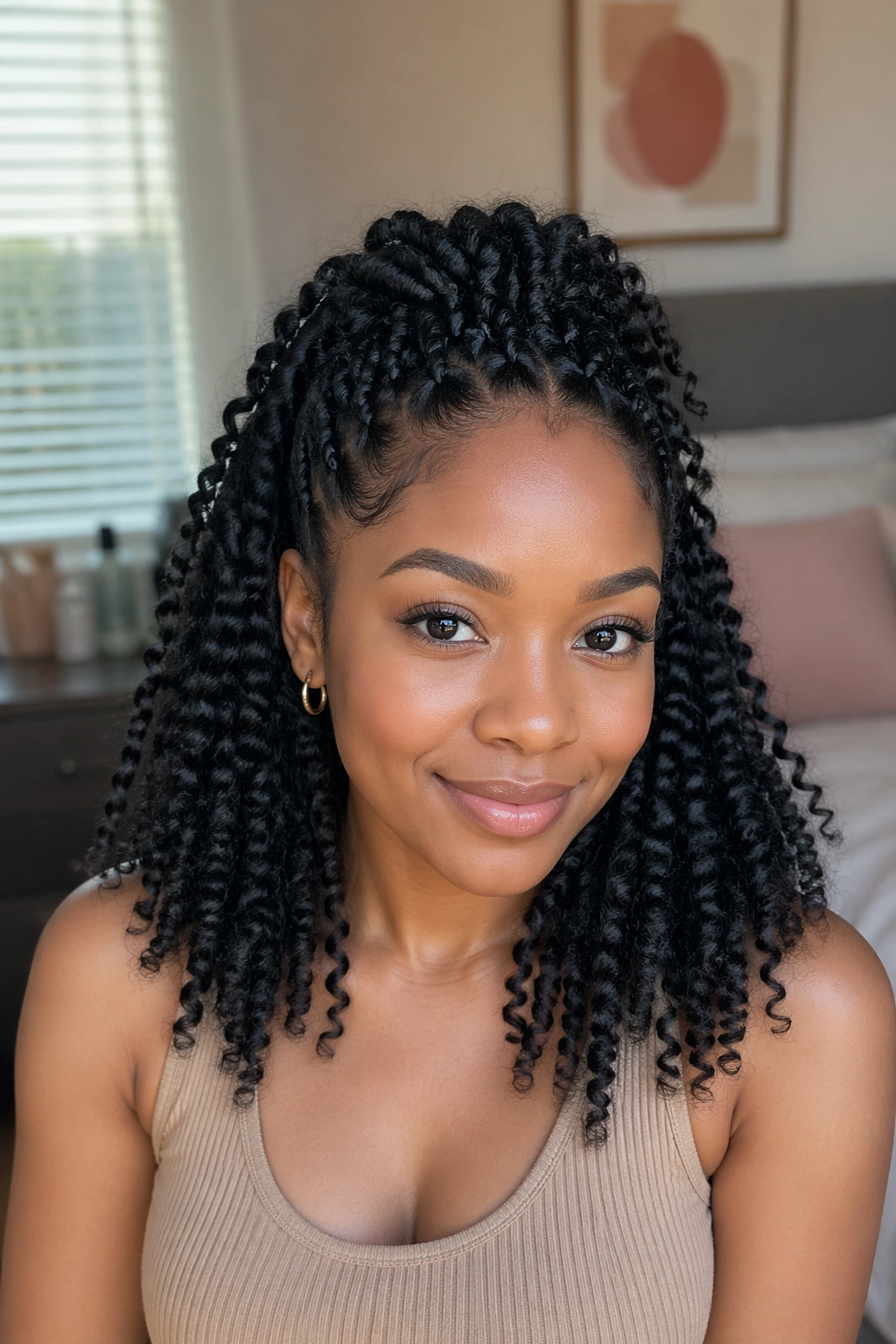 Close-up portrait of a real woman with braid-out half up half down showing natural hair texture