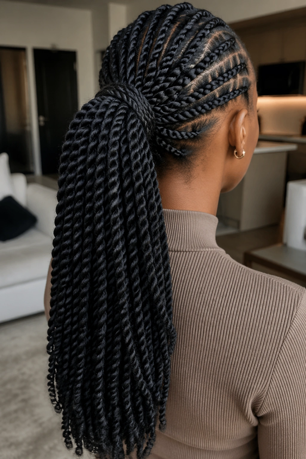 Back view of braided-back twist ponytail on a real woman