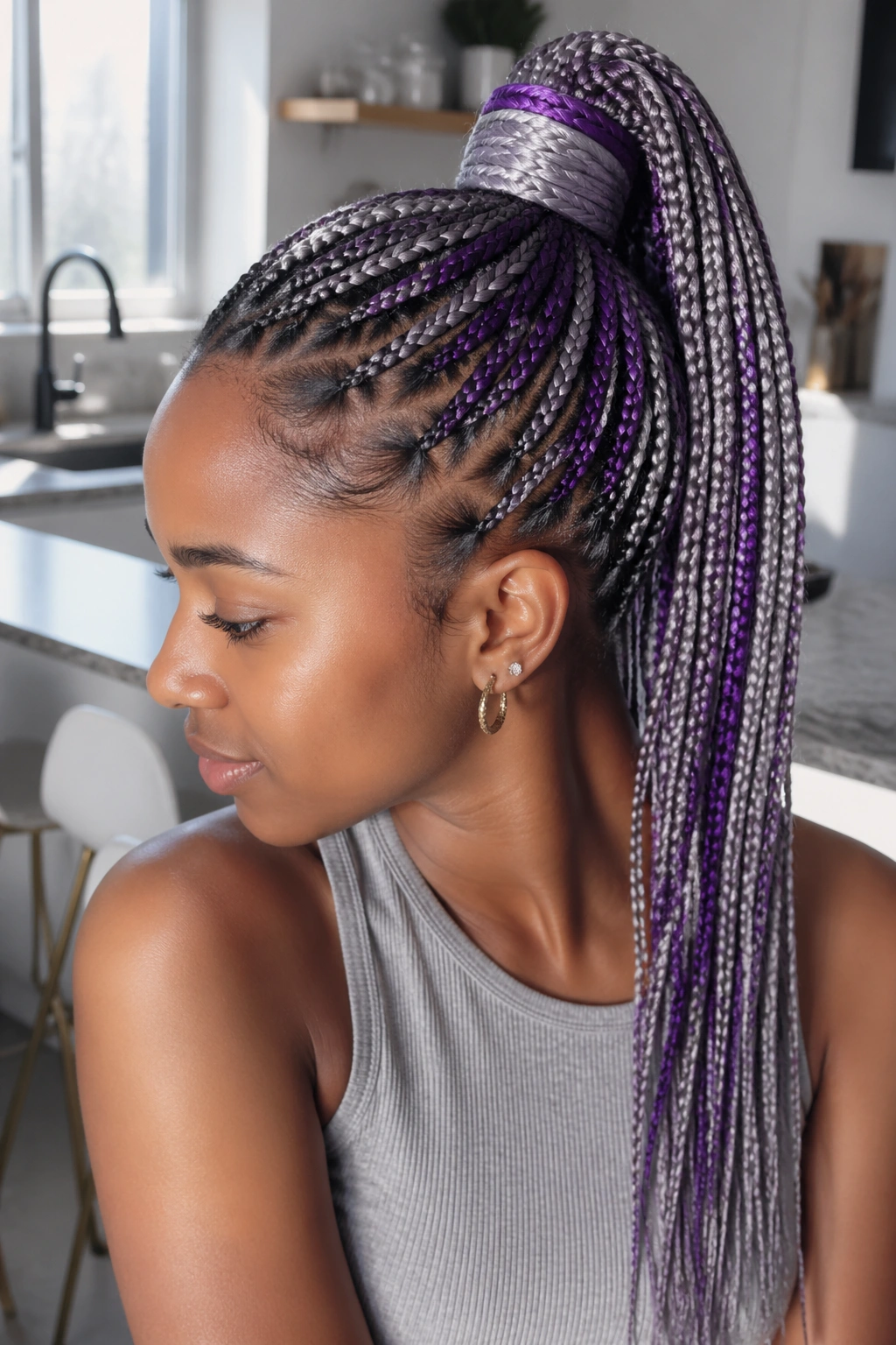Close-up of a real person with a high ponytail of grey and violet braids wrapped at the base.