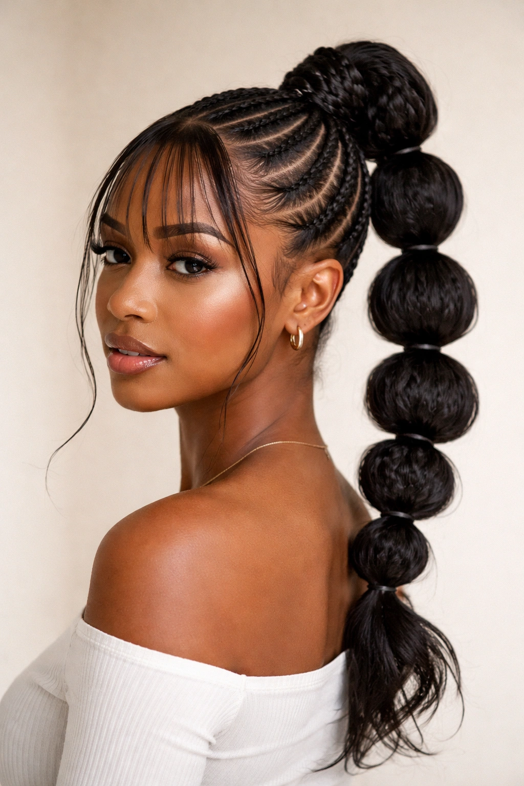 Bubble cornrow ponytail with thin feed-in bangs, showing rounded bubble sections.