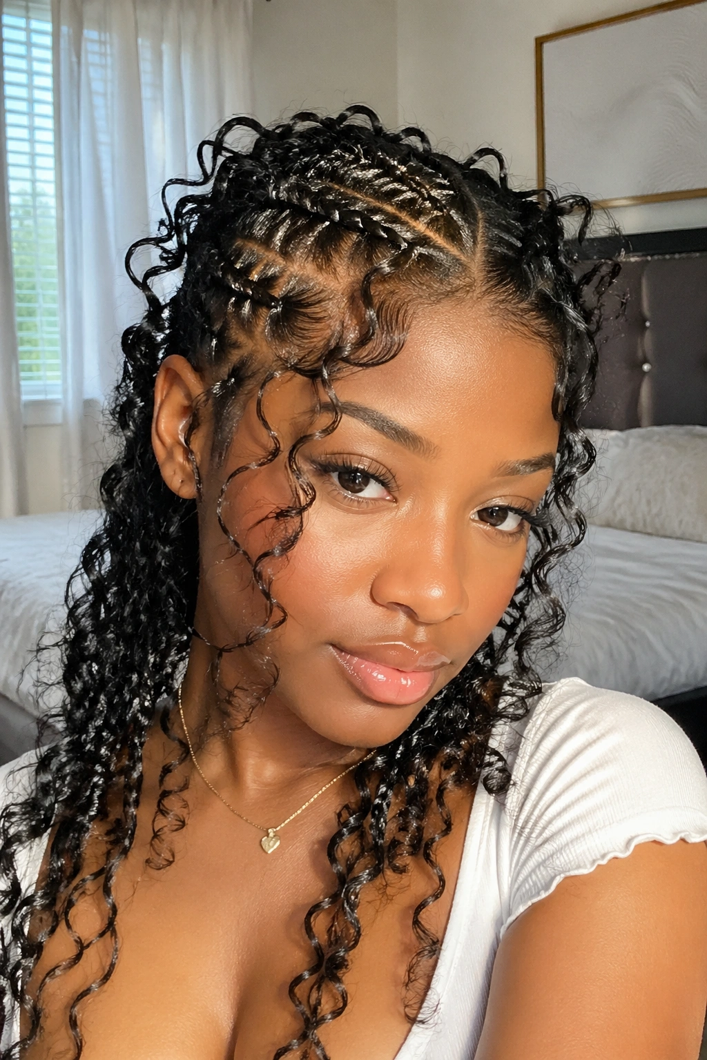 Close-up of butterfly cornrows on a real person in a bright room.