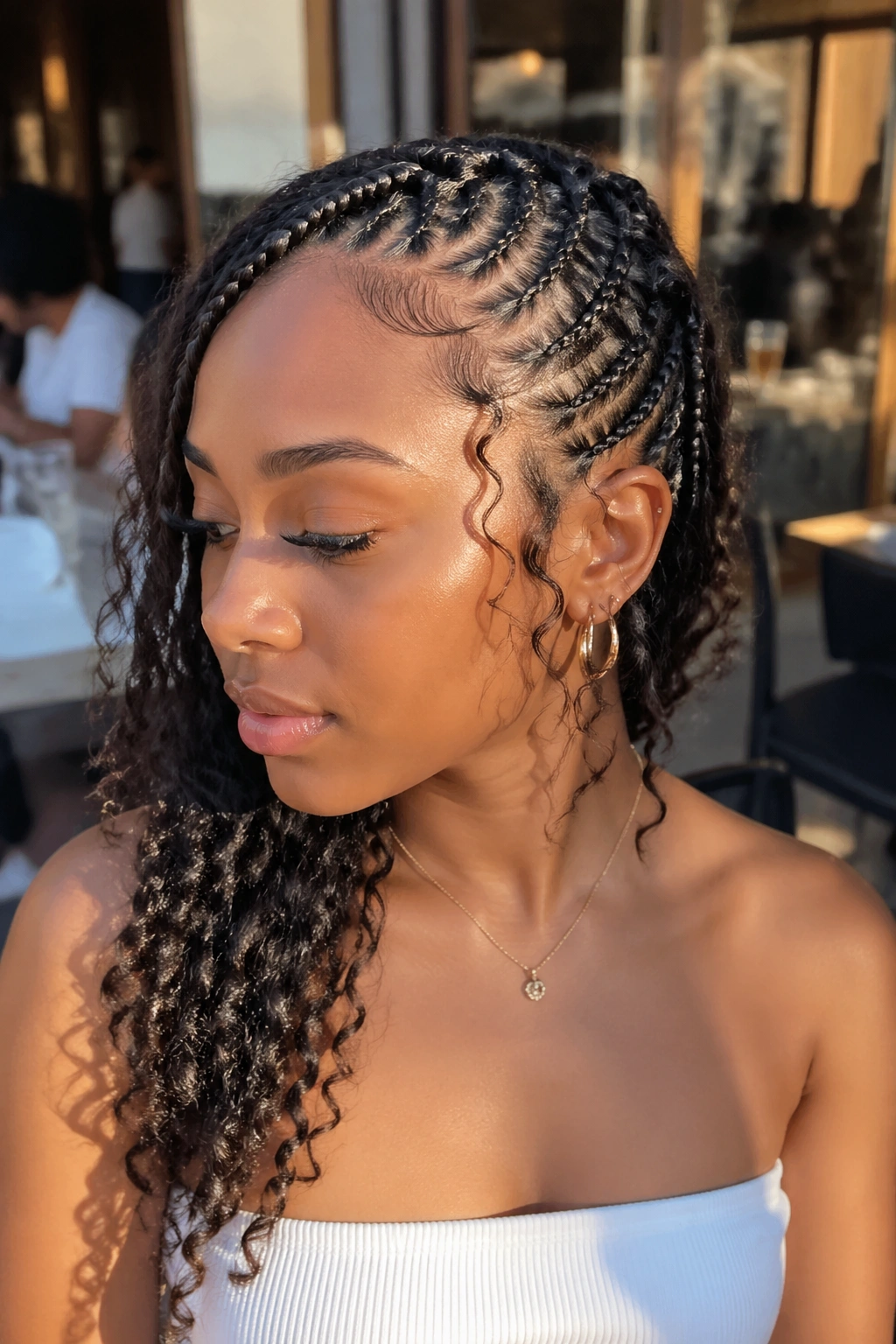 Close-up of lemonade-based butterfly style with curly ends on a real person.