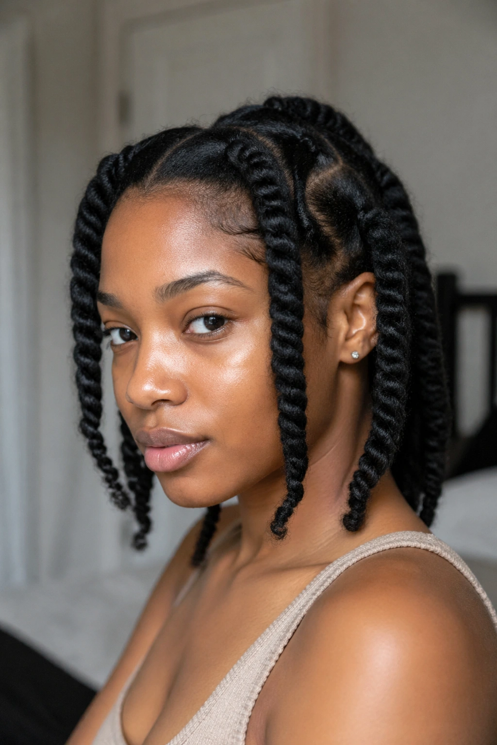 Close-up of a real woman wearing four chunky two-strand twists