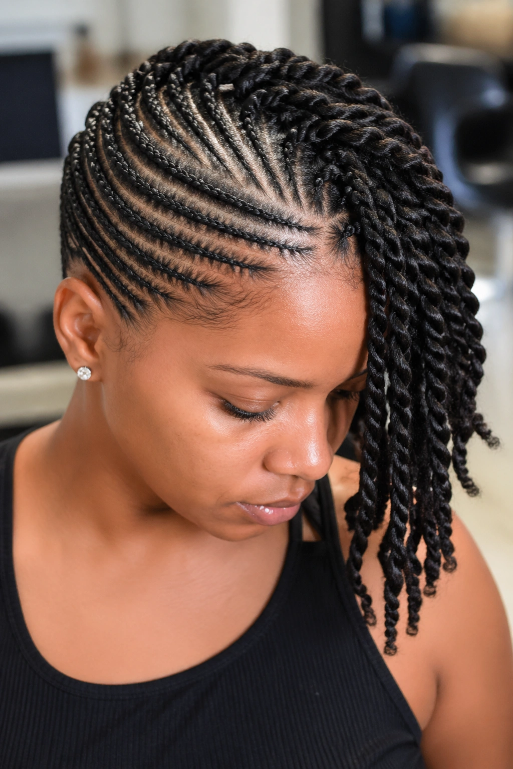 Cornrow cap with protruding twists on a real person, dense top pattern and side twist drop.