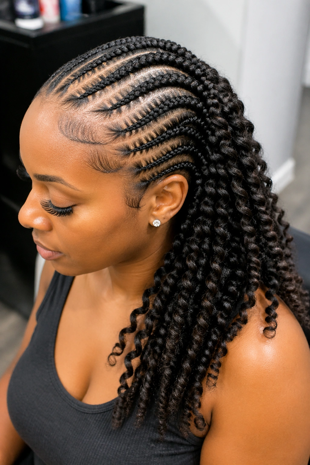 Portrait of a real person with a cornrow crown and back passion twists