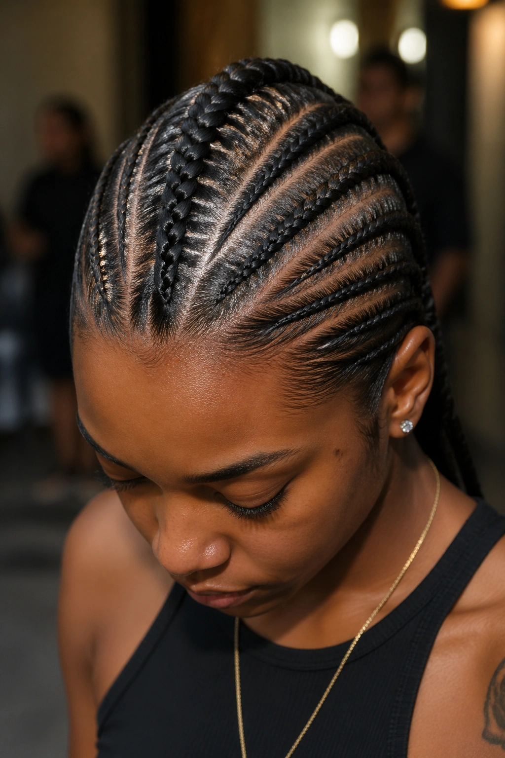 Real person with a French cornrow mohawk and slicked sides.