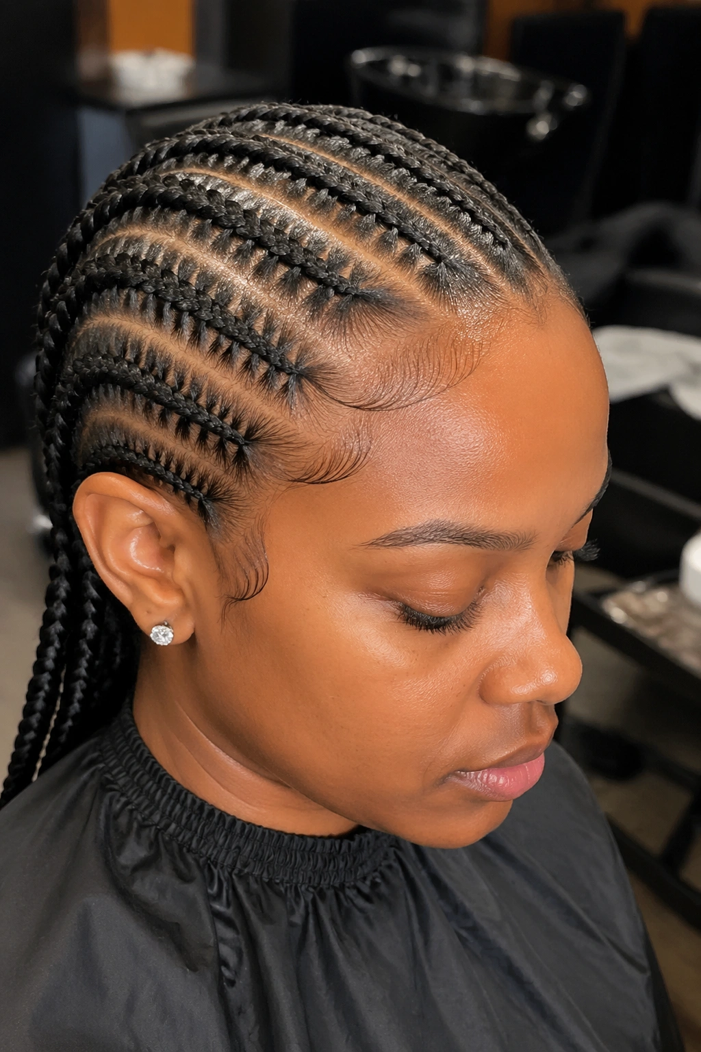 Close-up of a real woman with stitch cornrows straight back