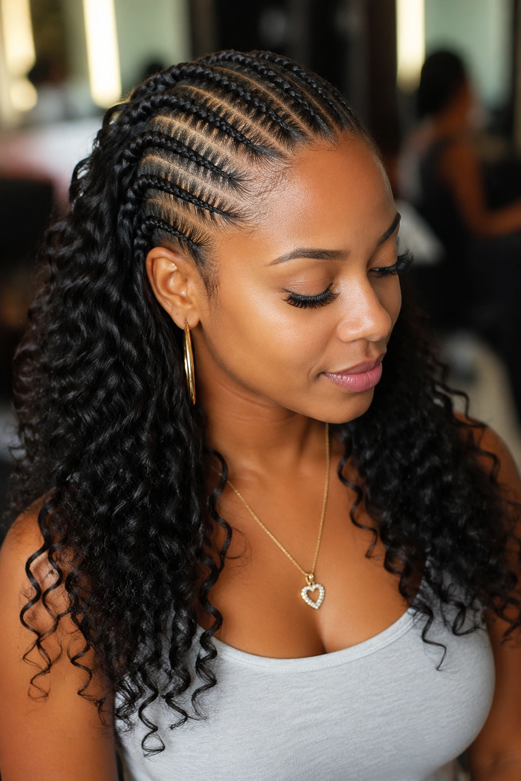 Close-up of curls at the ends of cornrows on a real person