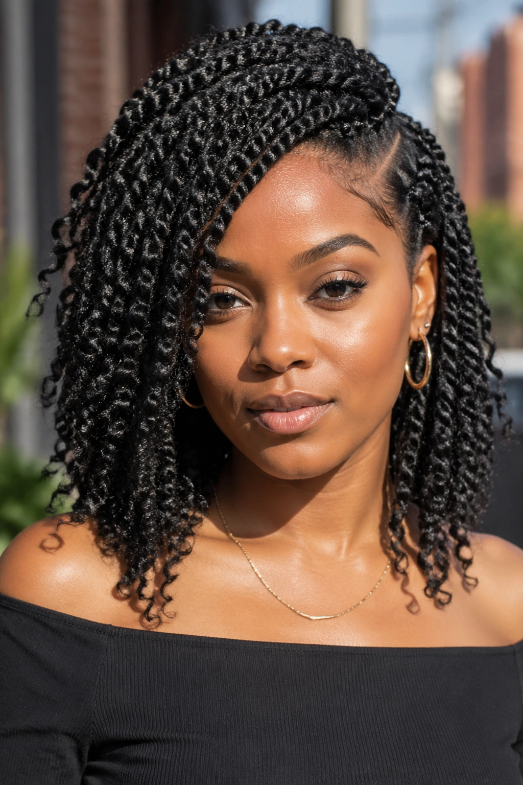 Portrait of real woman with defined side-part twist hairstyle in outdoor urban setting