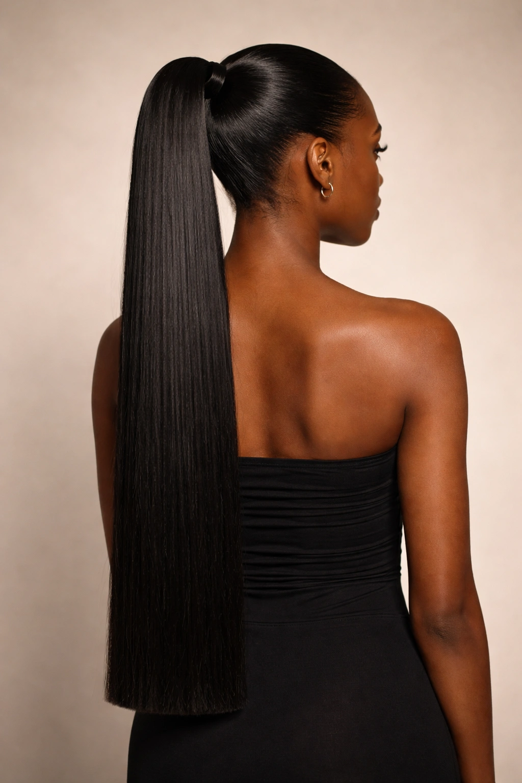 Ultra-long ponytail with blunt tail on straightened hair, back view