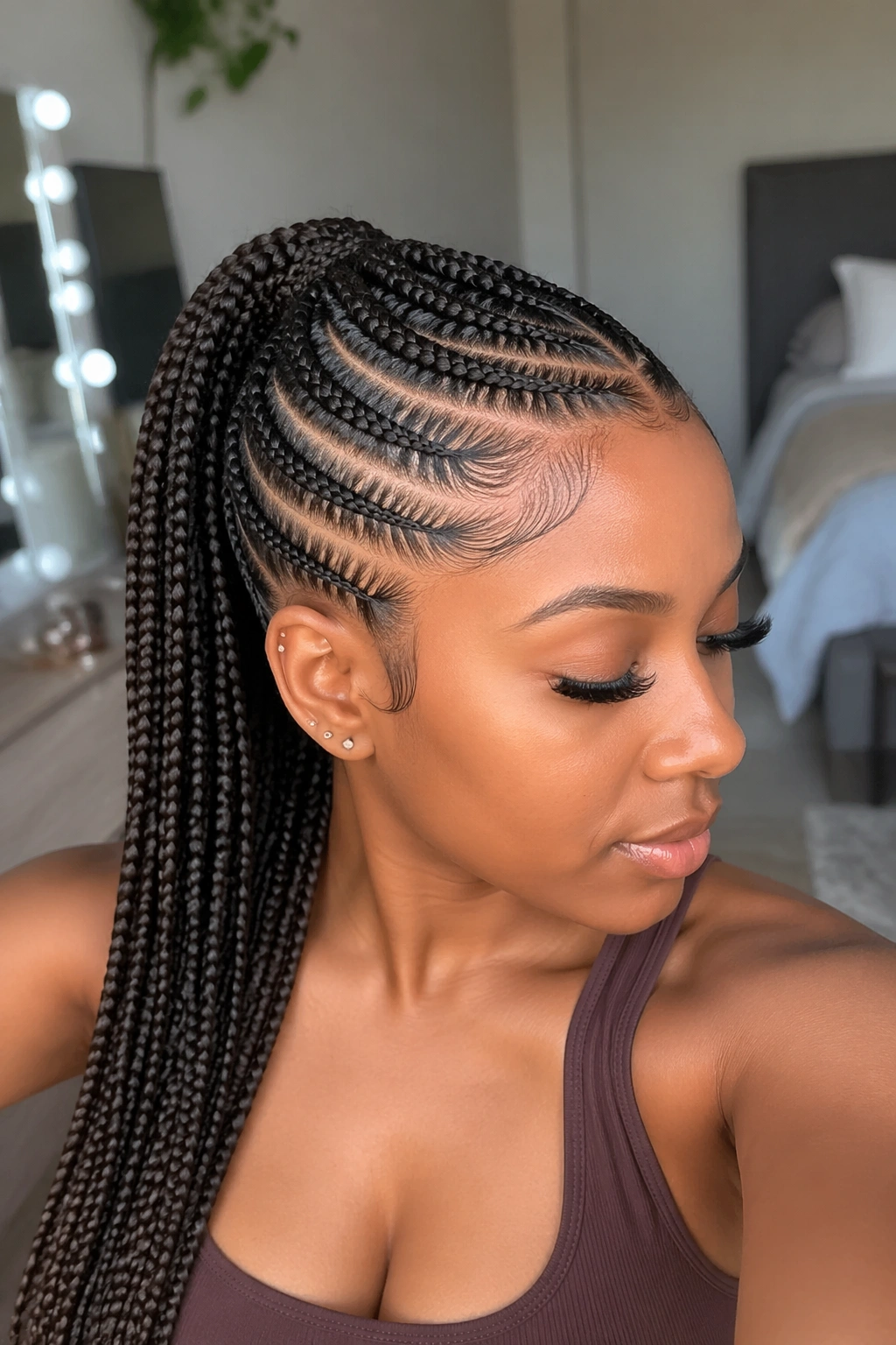 Close-up of a real woman with feed-in braided mid ponytail under natural daylight