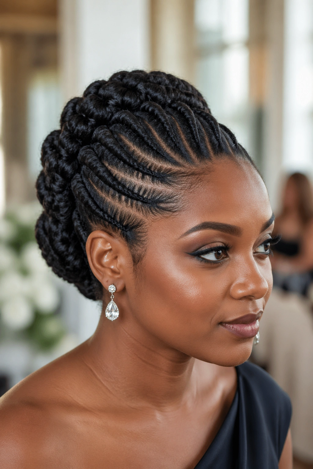 Close-up of a real woman with Sculptural Flat Twist Updo showing crown twists
