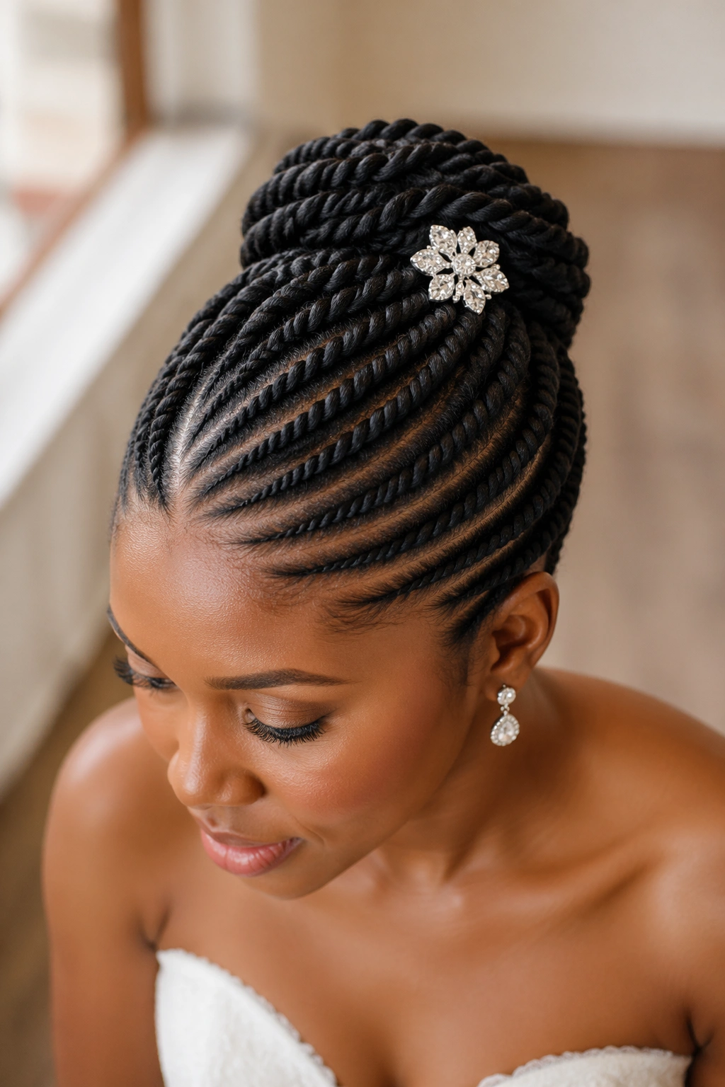 Close-up of a bride with a flat twist updo showing precise parting