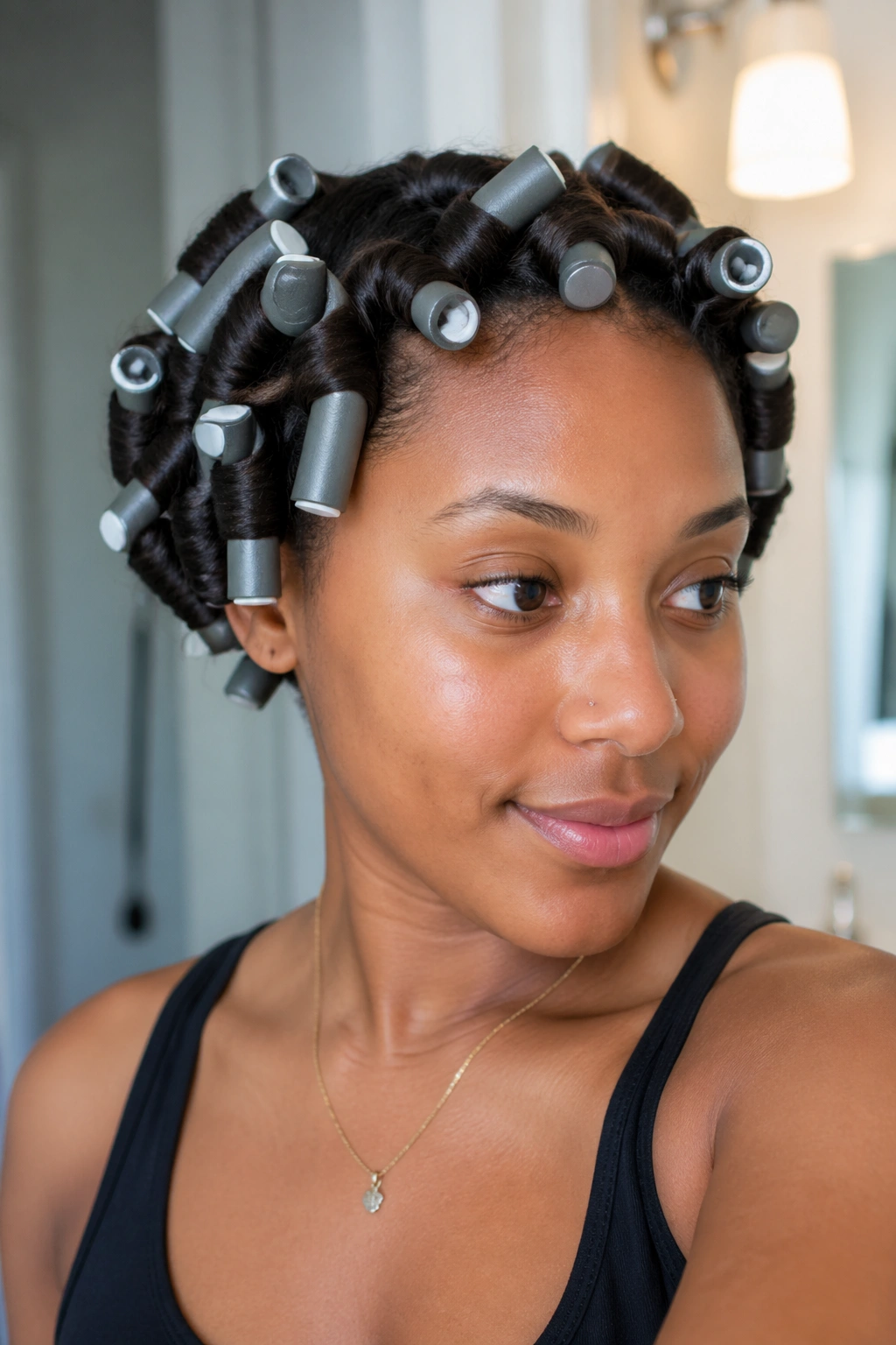 Close-up of a real woman with flexi rod curls on damp afro hair