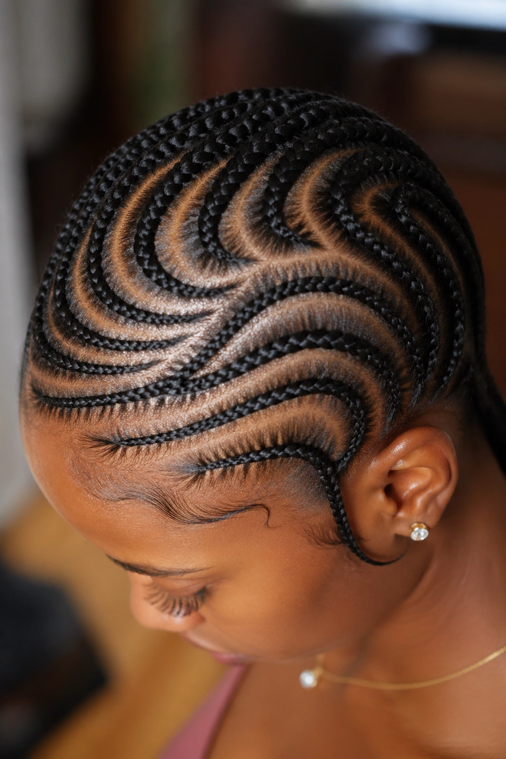 Real woman with freehand cornrow crown pattern