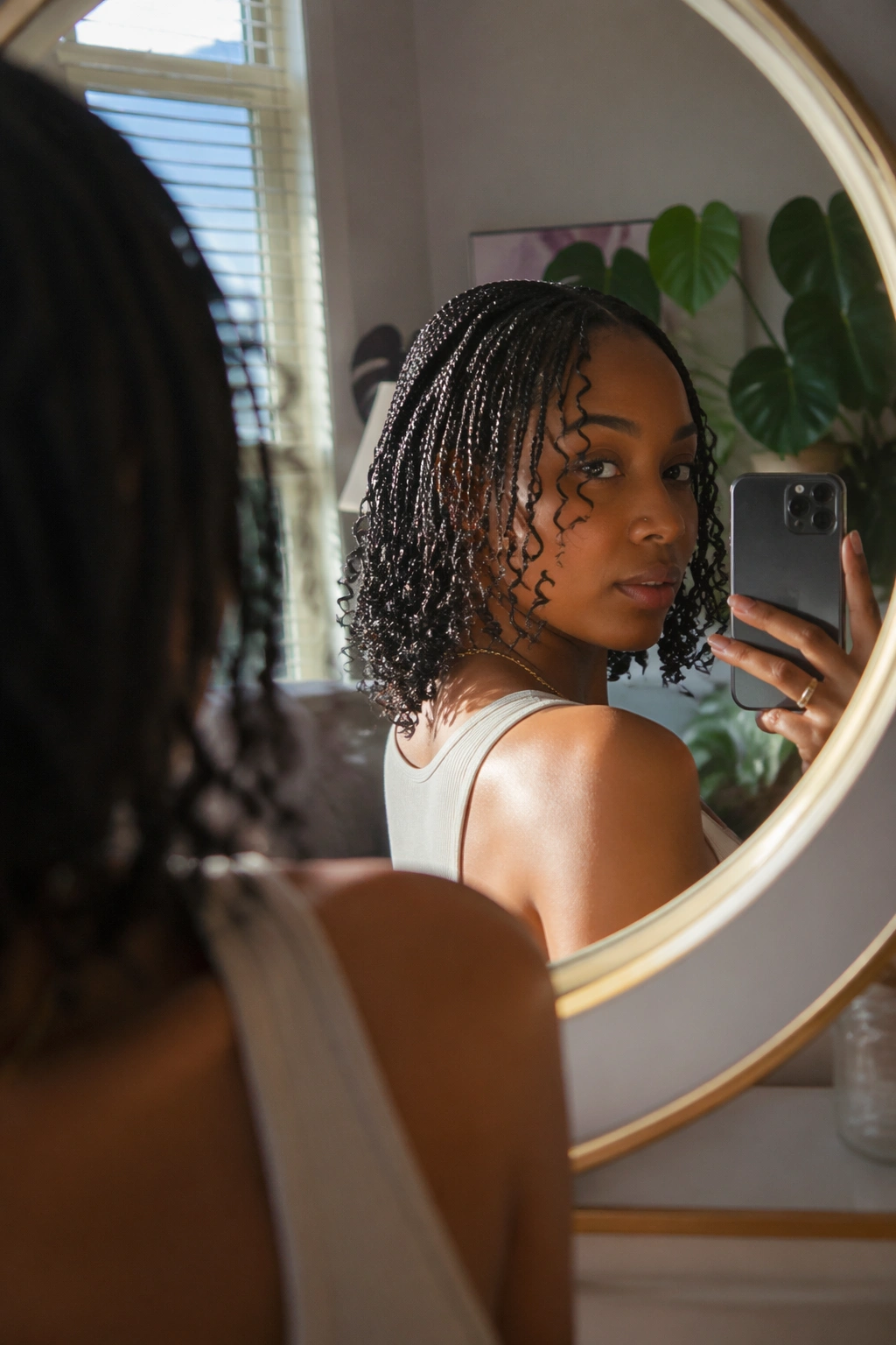Mirror selfie of goddess braids with soft curls