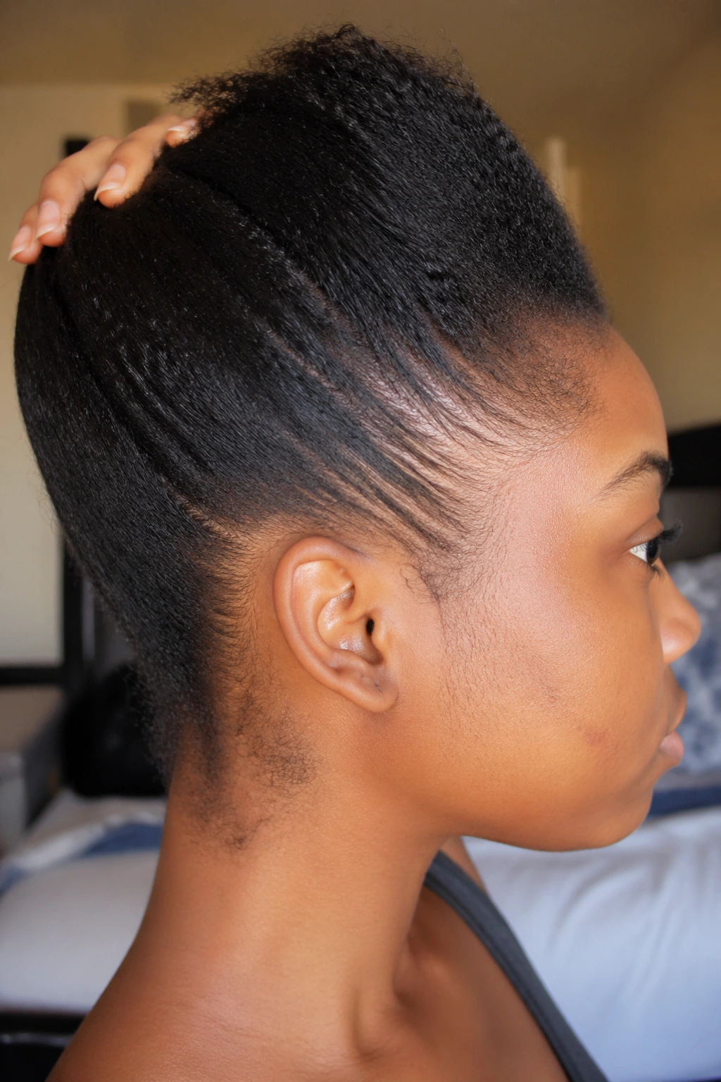 Profile close-up showing 3 inches of stretched hair for small cornrows