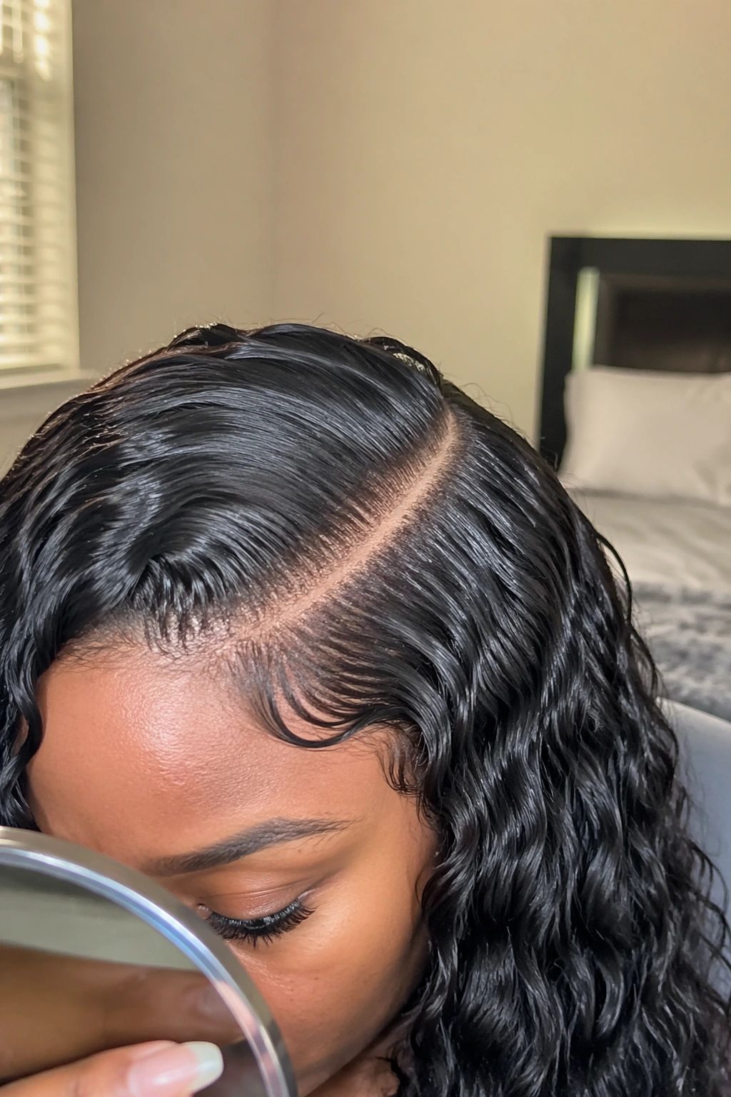 Close-up deep side part water wave sew-in