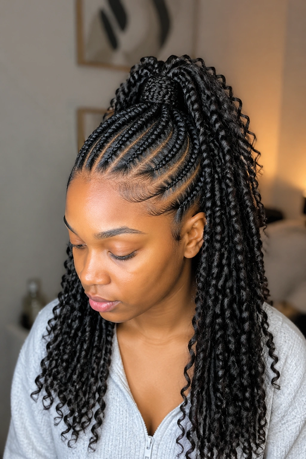 Close-up of a real woman with half-up cornrow base and flowing passion twists