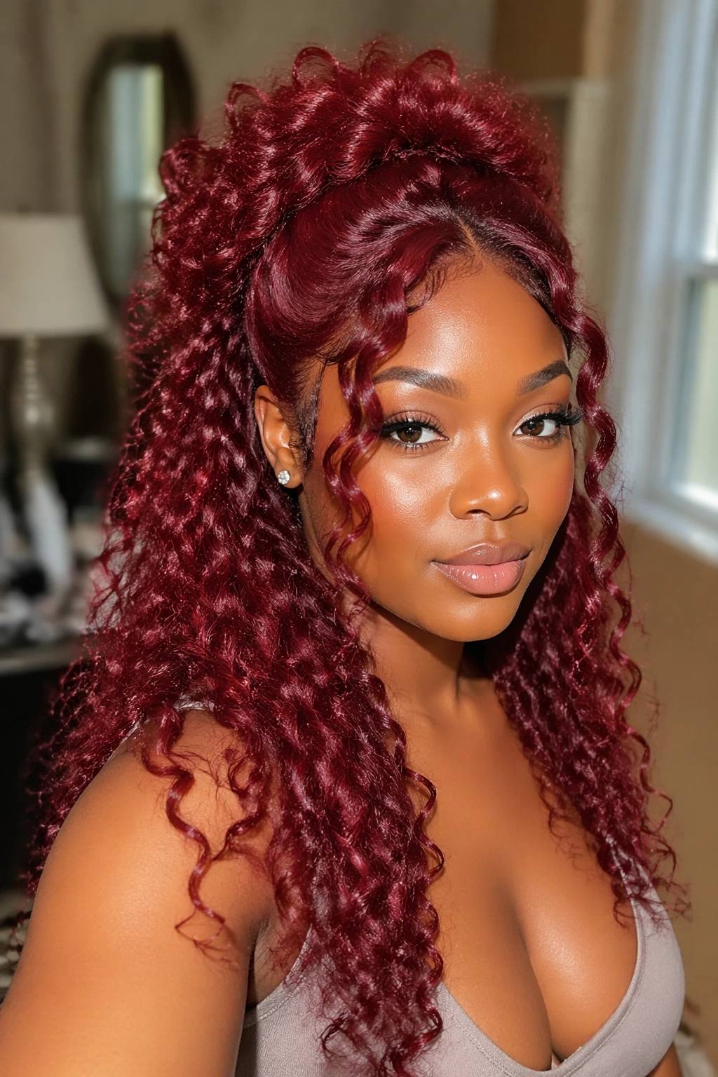 Real person in a red curly wig wearing a half-up half-down style with a curly crown.