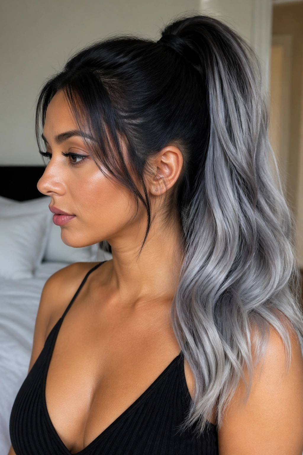 Close-up of a real woman's head with a black-to-silver gray high ponytail