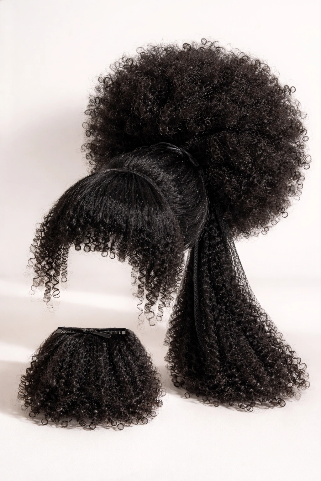 Jumbo Afro Puff with Bangs extension showing large puff and front bangs on neutral background