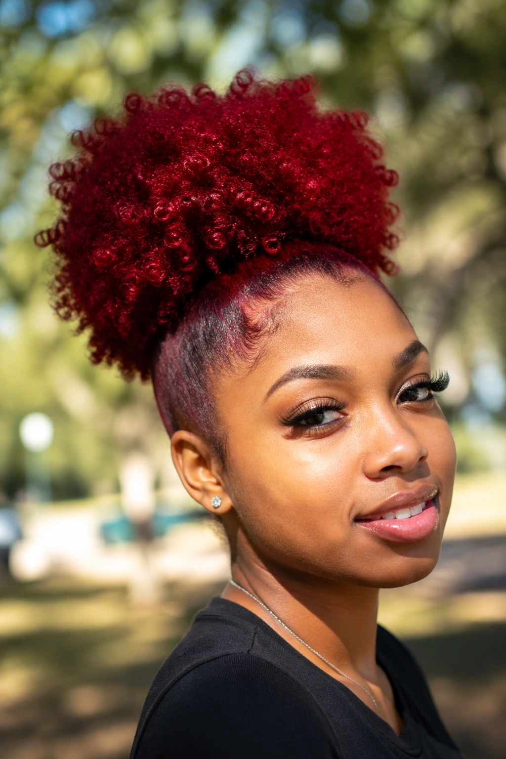 Close-up of kinky-curly red puff ponytail on a real woman