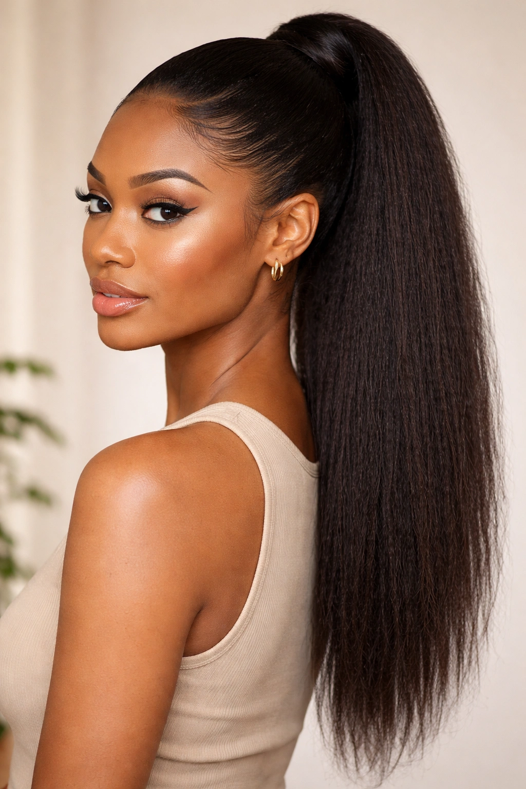 Kinky straight weave ponytail with textured, natural-blend look.