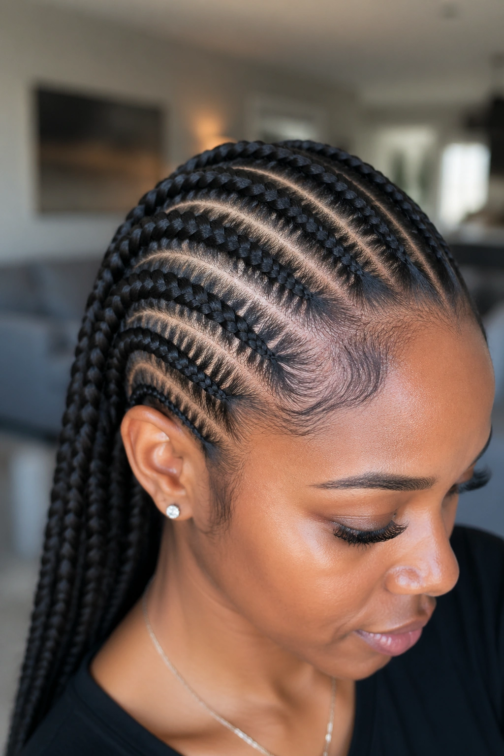 Real woman with knotless feed-ins showing invisible roots
