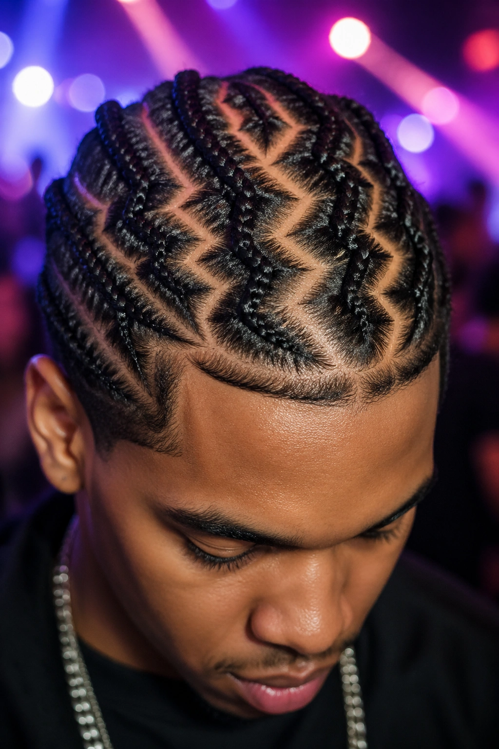 Jagged lightning bolt cornrows on a real person's scalp.