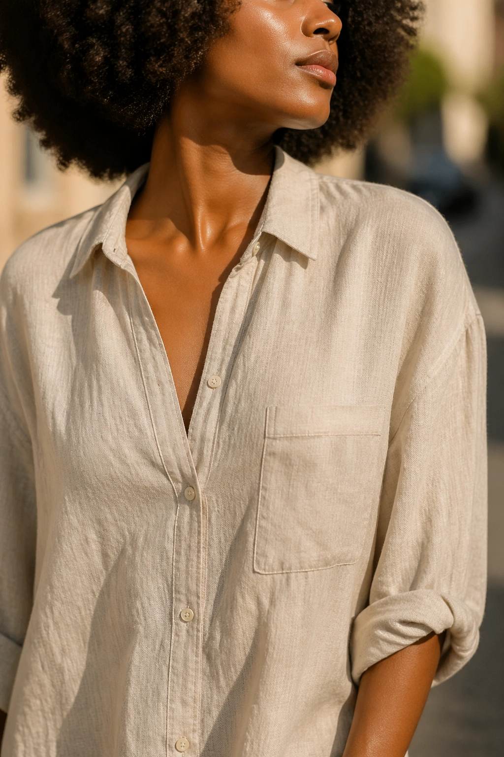 Close-up of linen fabric on a real person in warm sun