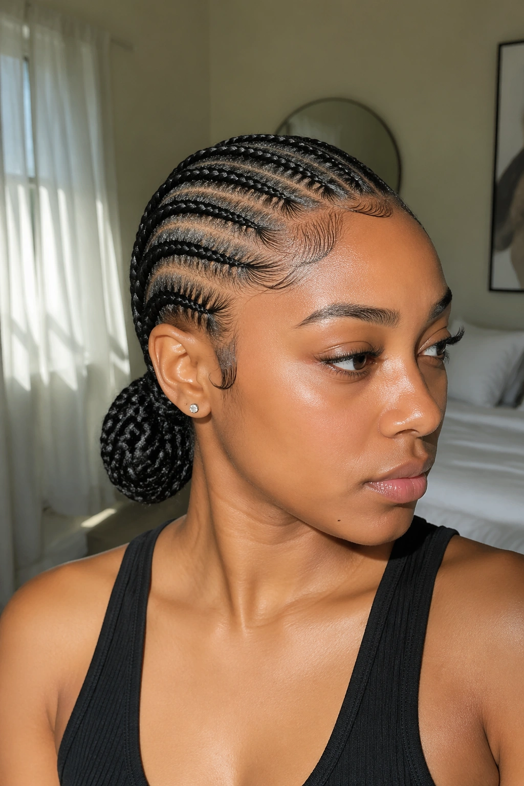 Close-up of a real woman with a low nape feed-in ponytail and neat edges.