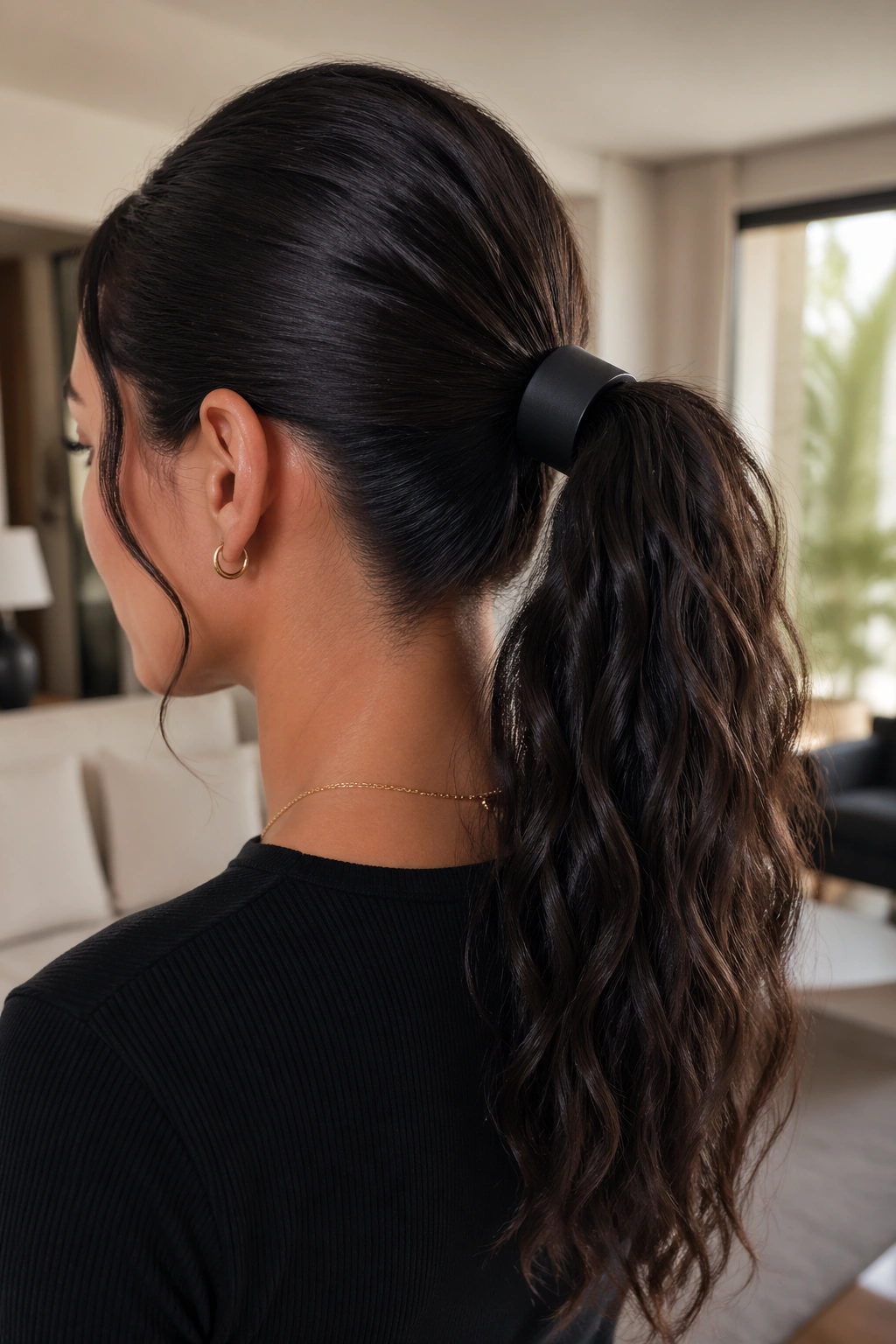 Close-up of real woman's ponytail with matte-black cuff accessory