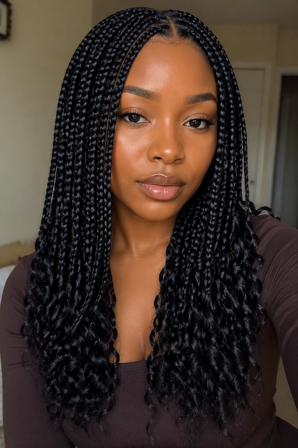 Close-up of a real person with natural-black box braids and soft ends