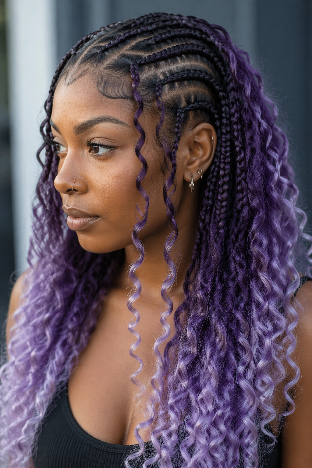 Bohemian cornrows with an ombre purple gradient on curls.