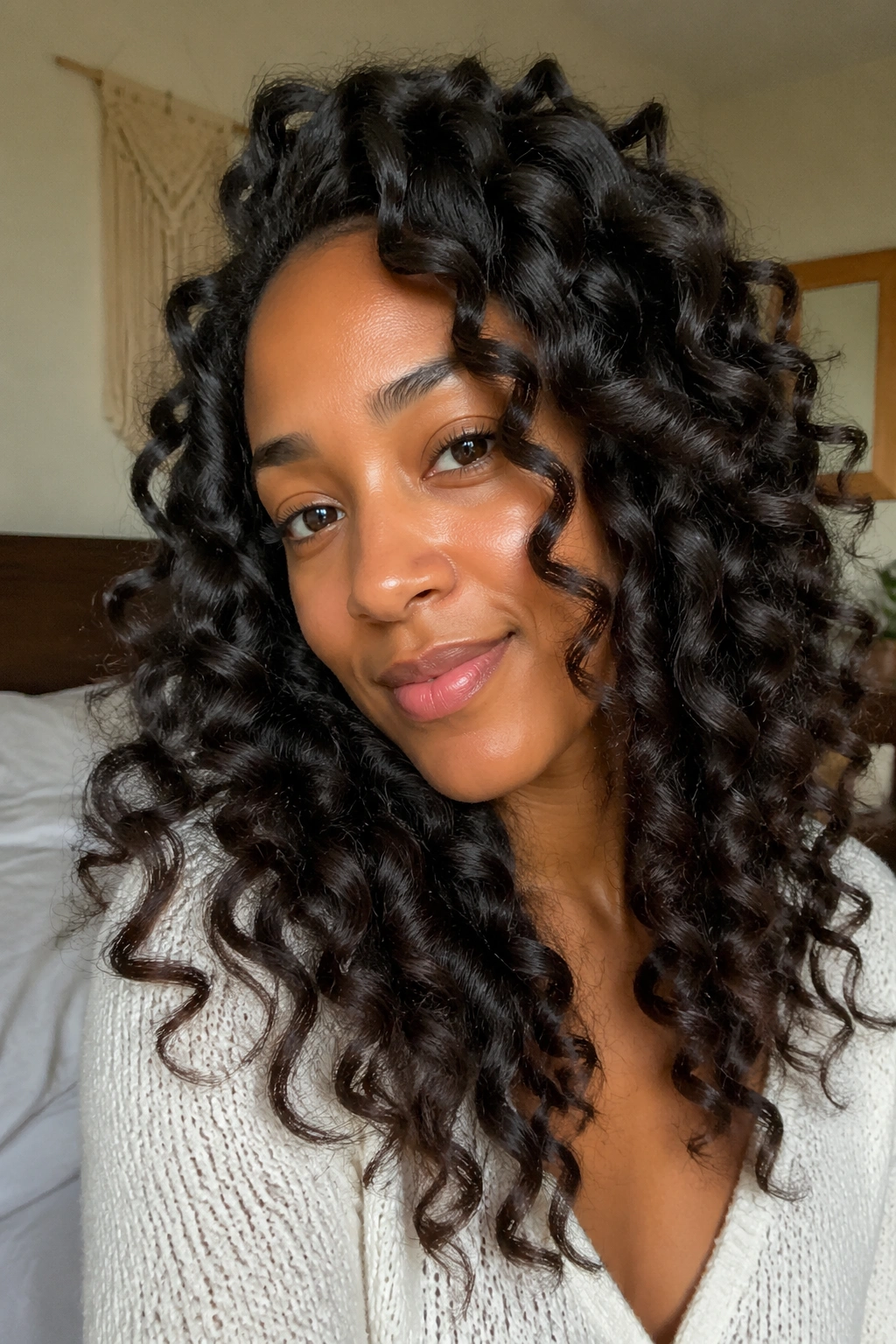 Portrait of a real person with soft, no-heat overnight wand curls.