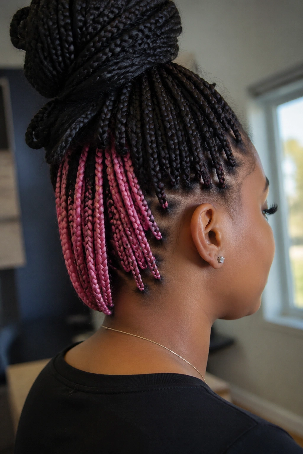 Real person with hidden pink peekaboo underlayers in box braids