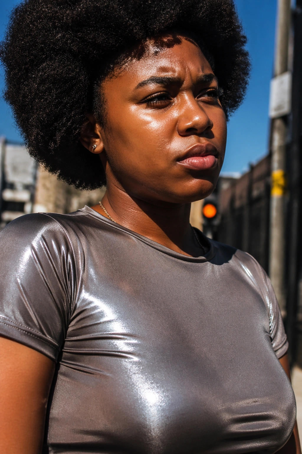 Model in shiny polyester-blend fabric looking uncomfortable in heat