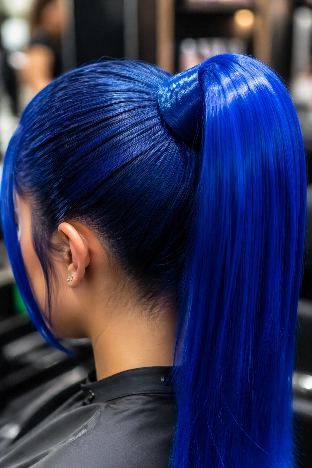Close-up of electric blue high ponytail at salon