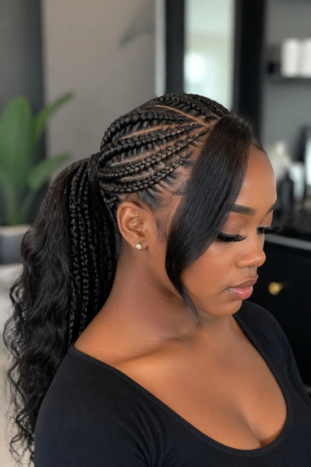 Portrait of a real person showing protective mid swoop ponytail with braids and a front swoop