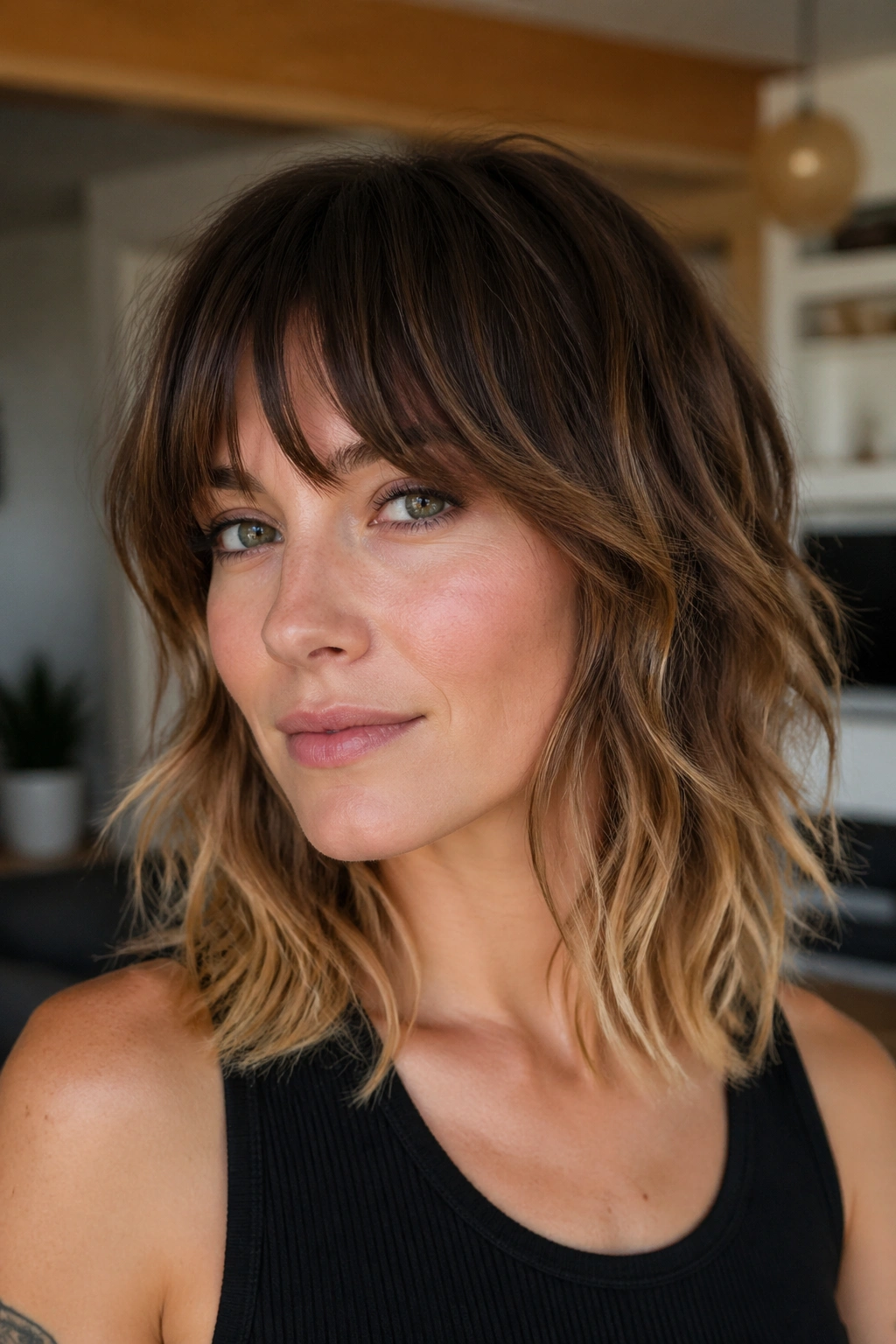 Close-up of a real woman with razor-cut midi shag and golden tips