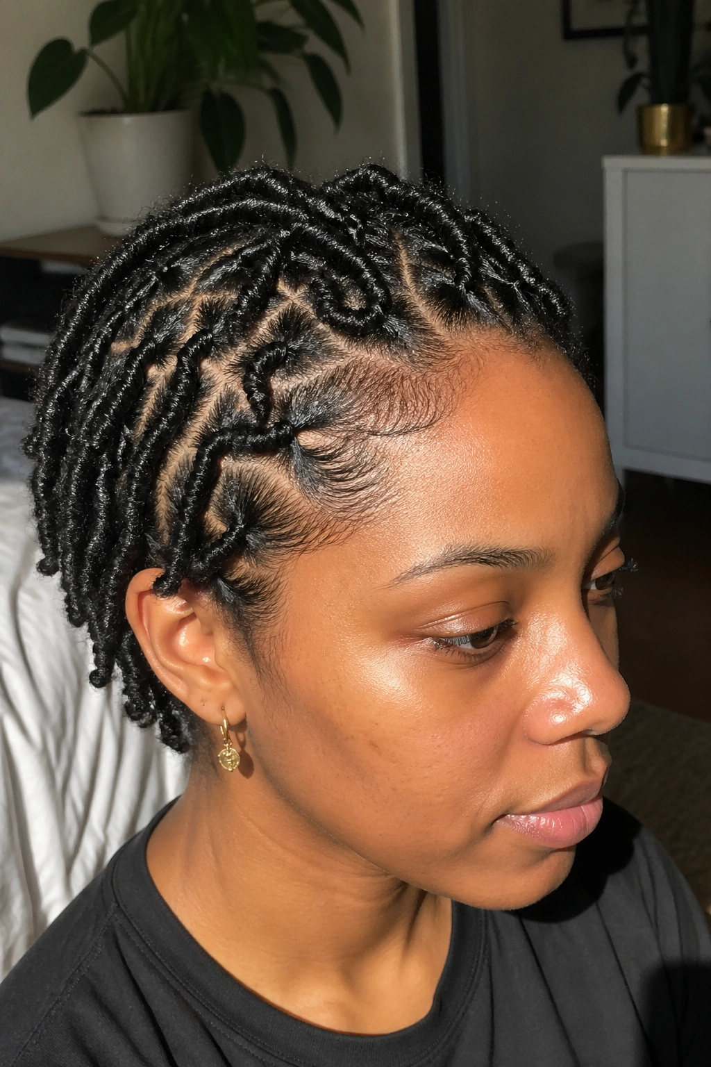 Close-up portrait of a real person with defined S curl starter locs.