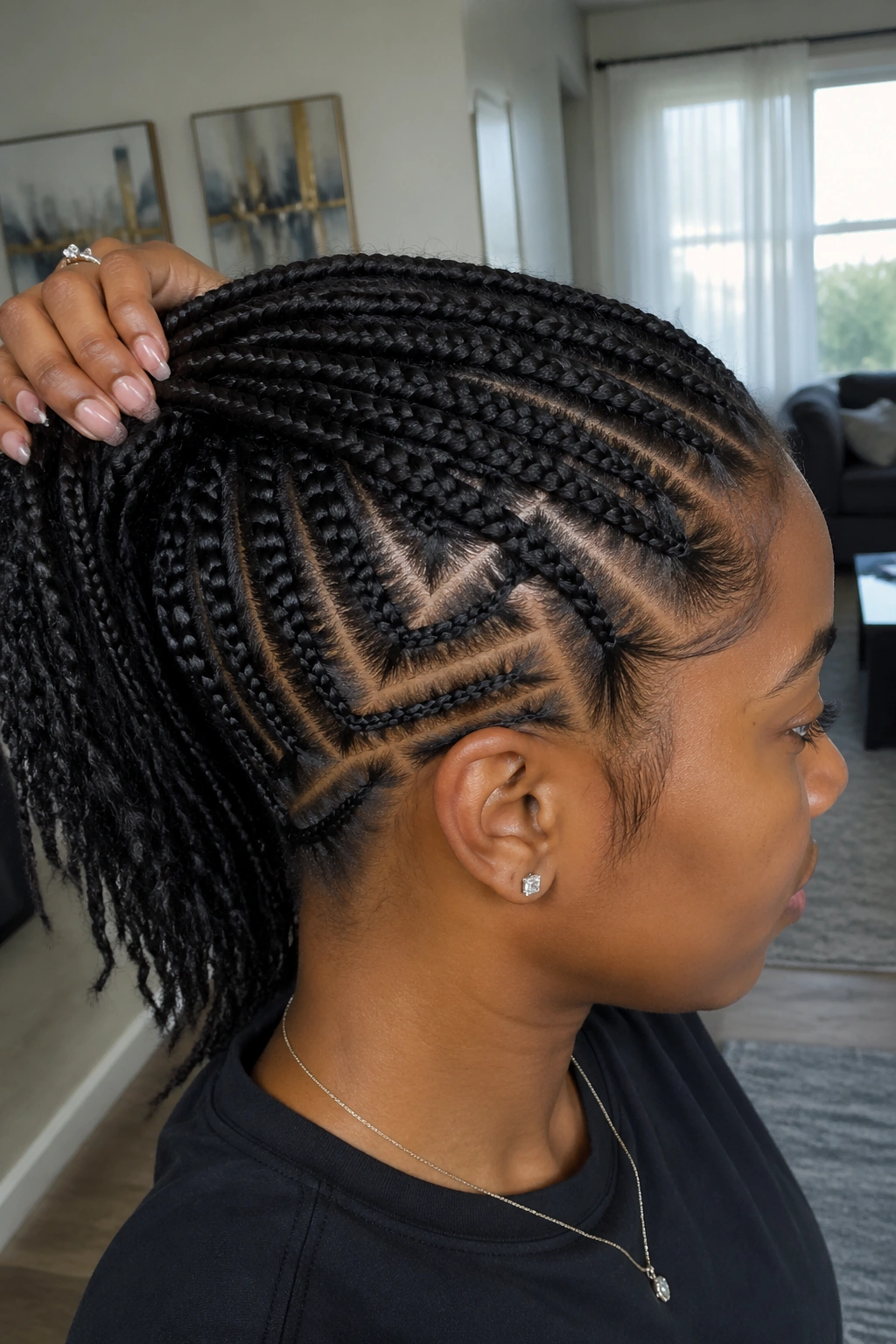 Portrait showing scalp designs between top cornrows and wider underlayer braids.
