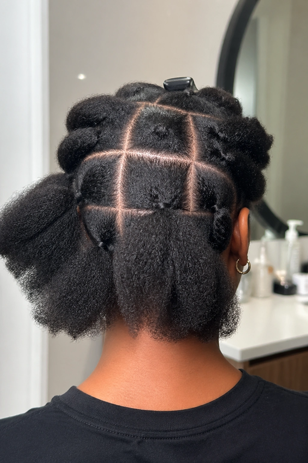 Back of head with hair sections ready for brushing out