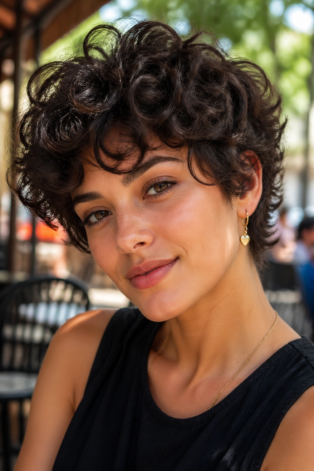 Portrait of a real person with a stylish short layered curly haircut